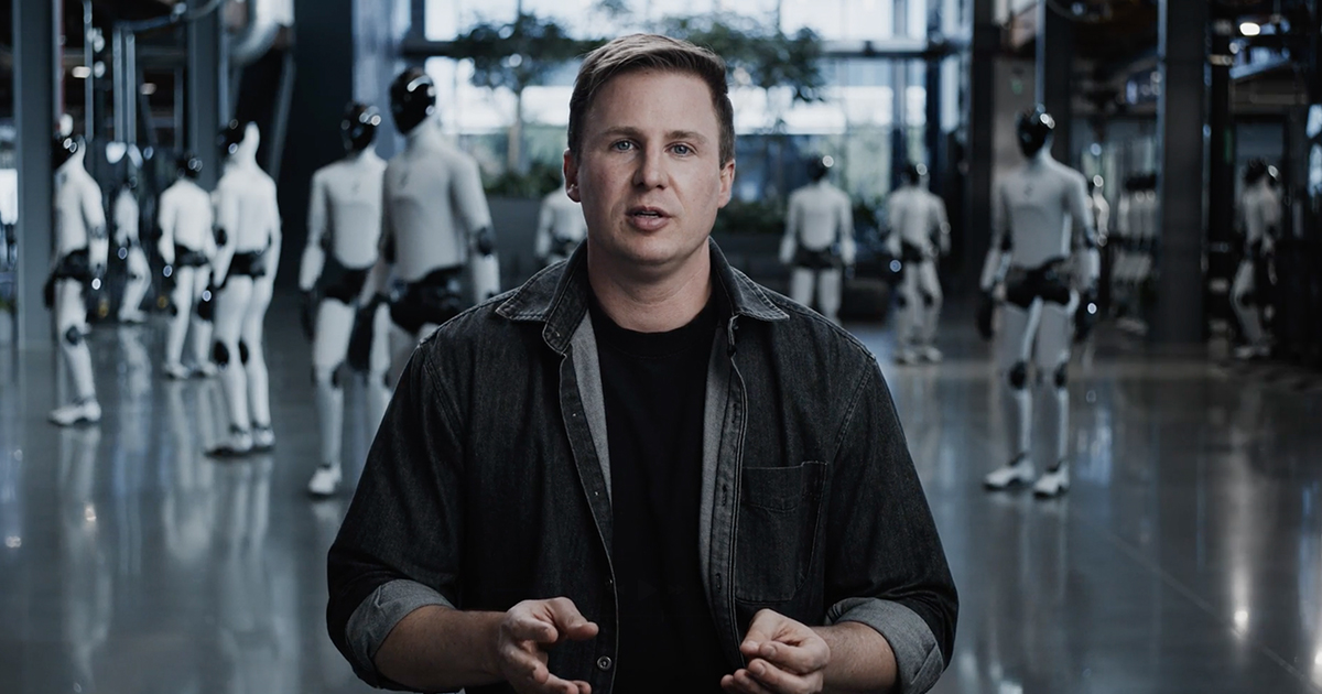 Figure founder speaking in a facility with humanoid robots